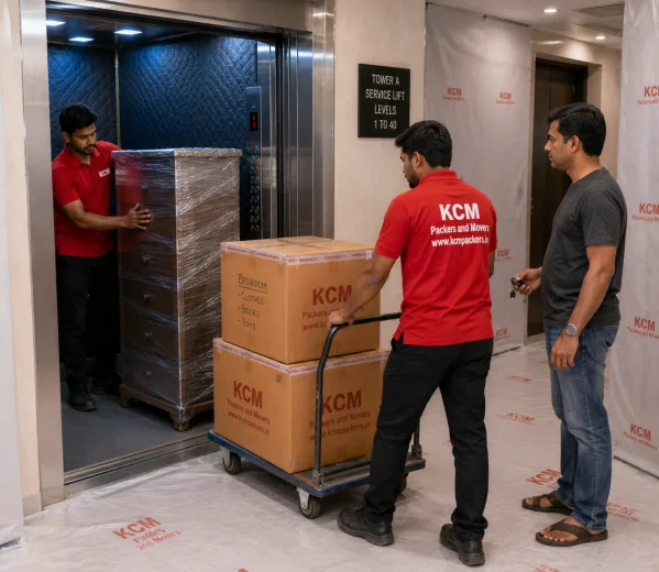 KCM crew handling a high-rise society move in Sector 119 Noida