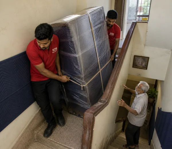 KCM crew handling a home move in Sector 12 Noida
