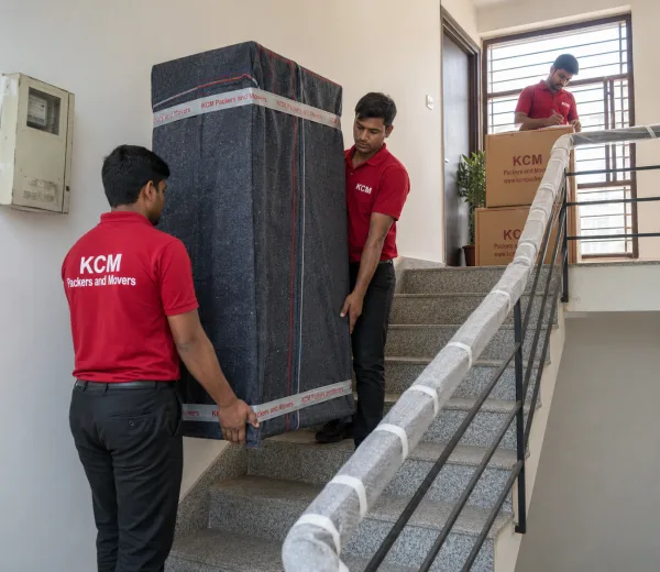 KCM crew handling a home and shop move in Sector 55 Noida