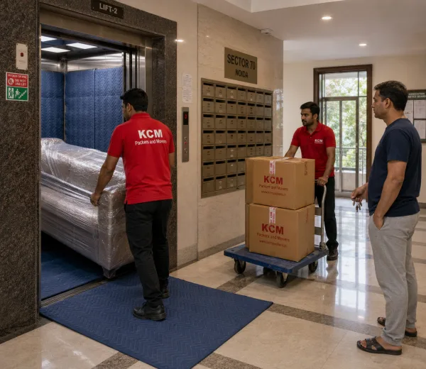 KCM crew handling a high-rise society move in Sector 70 Noida