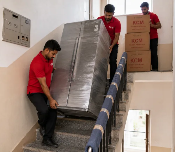 KCM crew handling a home move in Sector Mu II Greater Noida
